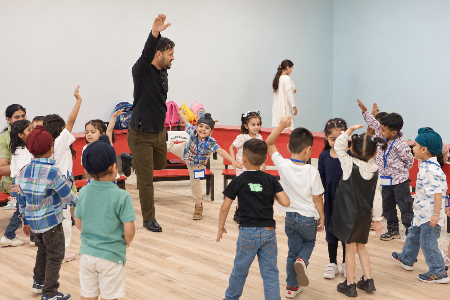 Early Years children dancing together
