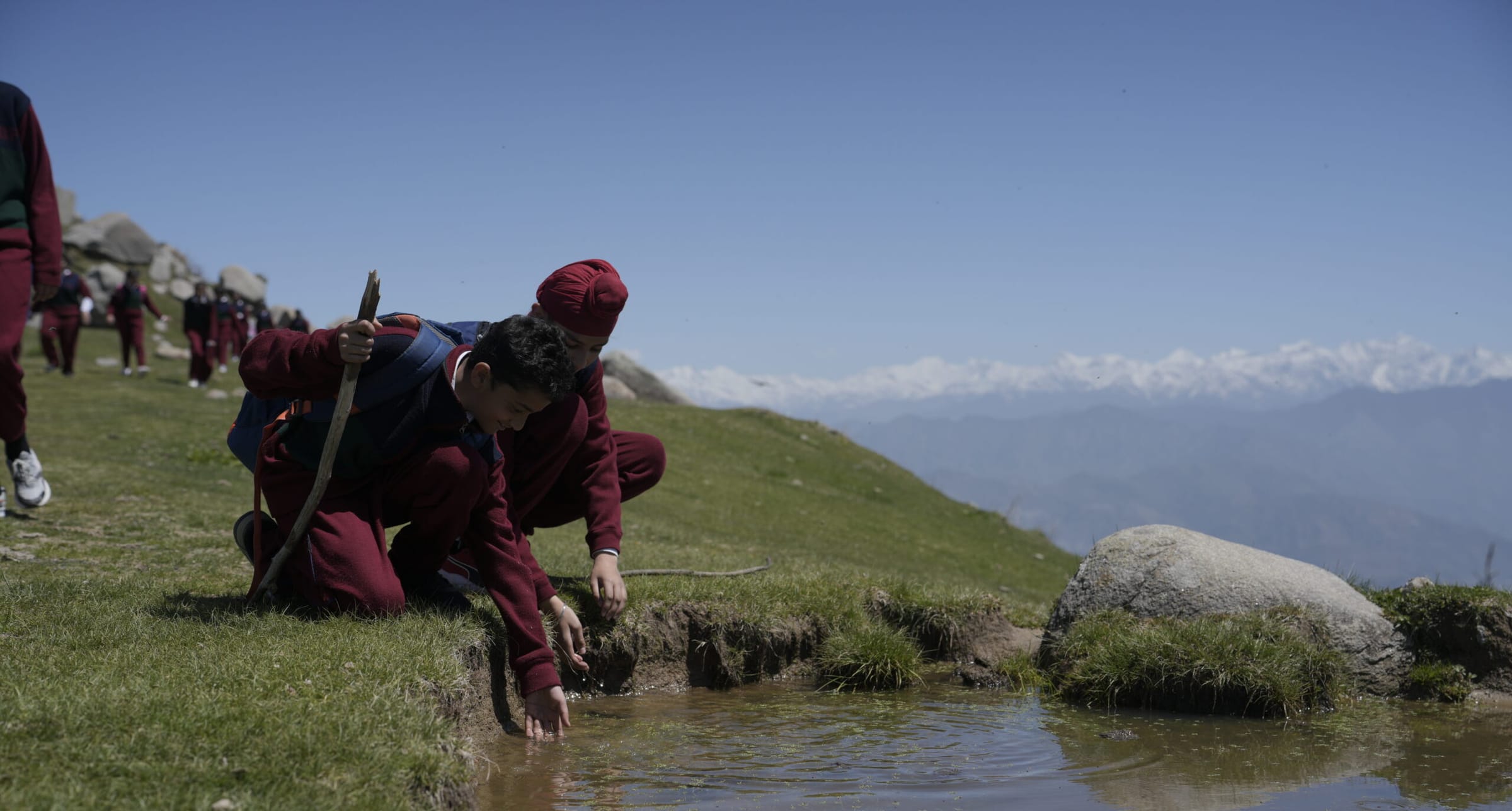 Students trekking above the tree line